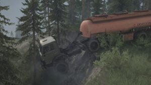 truck with oil hanging oon a cliff